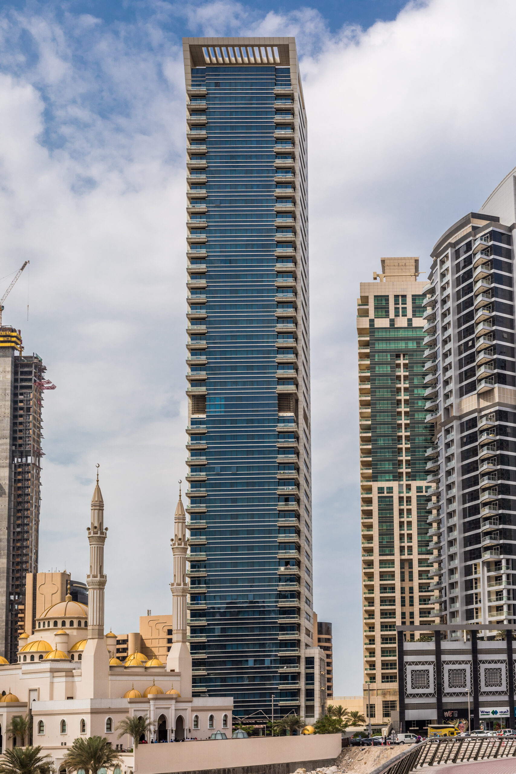 dubai, united arab emirates october, 2018: promenade and canal in dubai marina with luxury skyscrapers around, united arab emirates